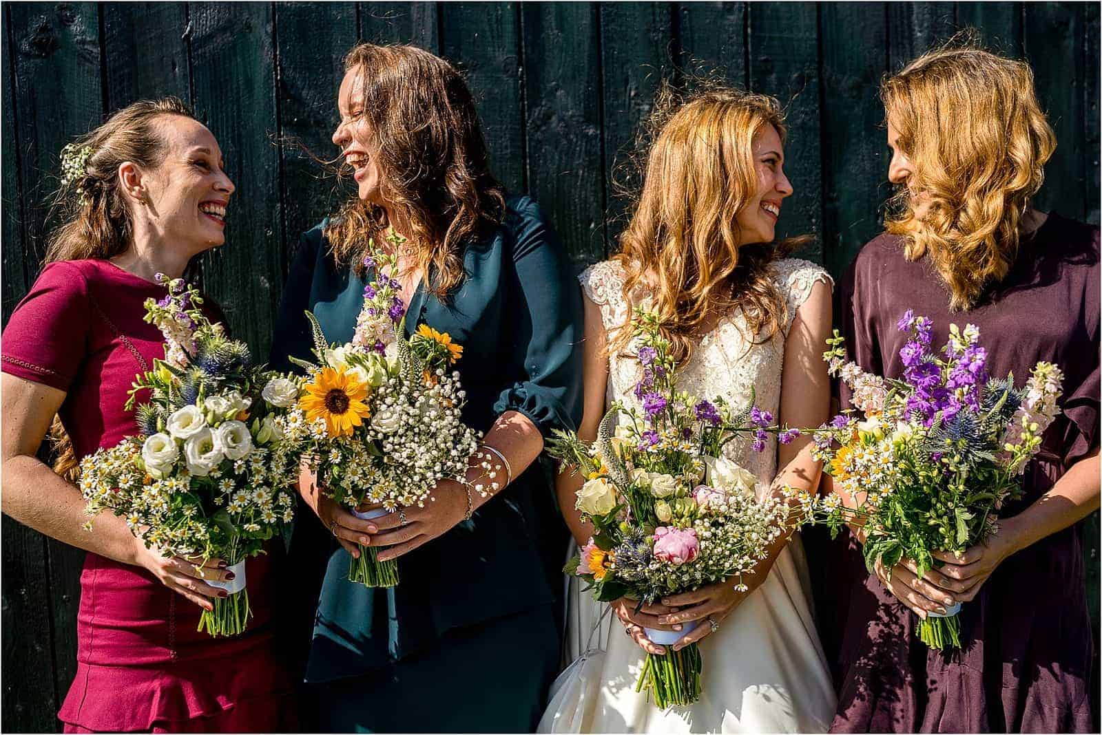 where to start with wedding planning - newly engaged - image of bride with bridesmaids laughing