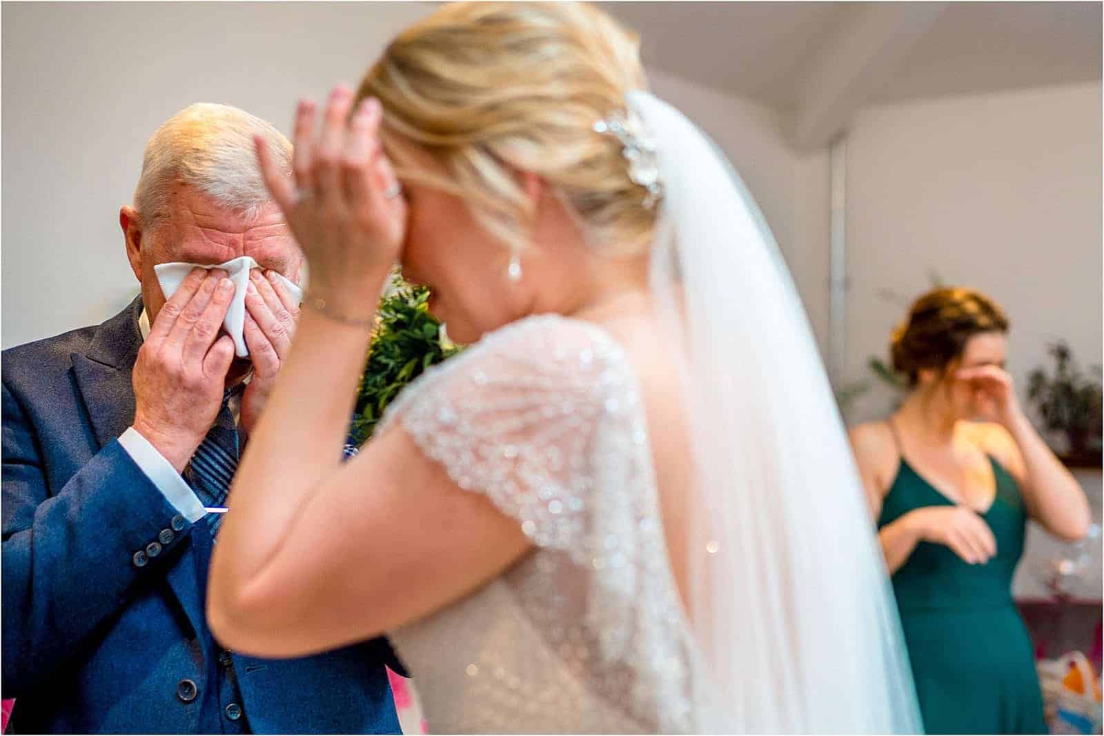 father of the bride crying when he sees his daughter - best wedding photography in warwickshire